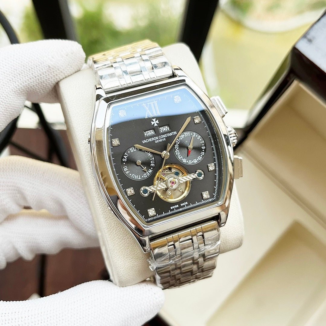 Two-tone men's wristwatch with blue dial, Roman numerals, and gold-accented movement.