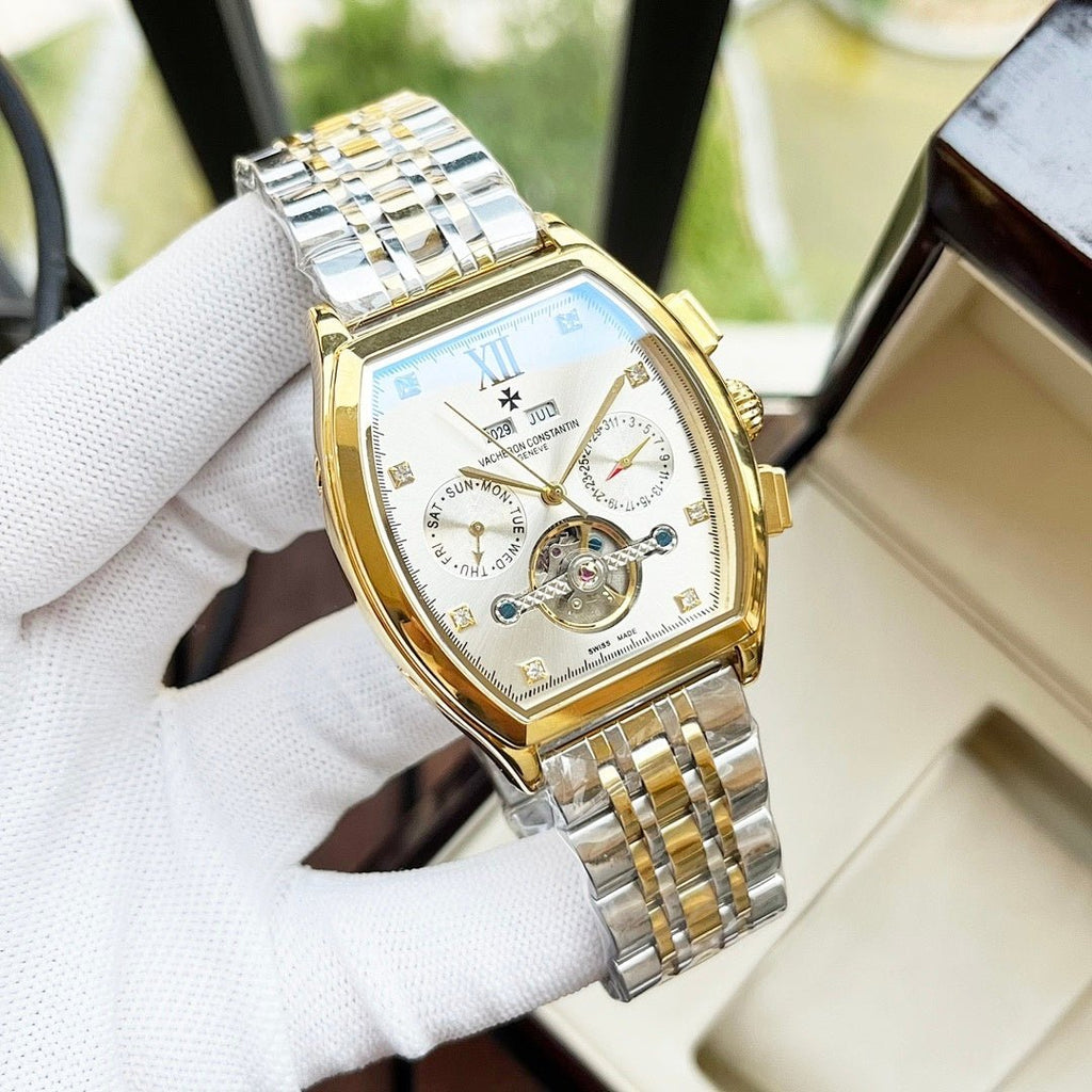 Two-tone men's wristwatch with white dial, Roman numerals, and gold-accented metal bracelet.