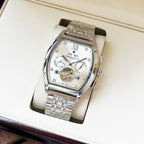 Stainless steel men's wristwatch with white dial, Roman numerals, on metal bracelet in box.