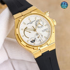 Gold watch with white dial and black strap, angled view of case and bezel