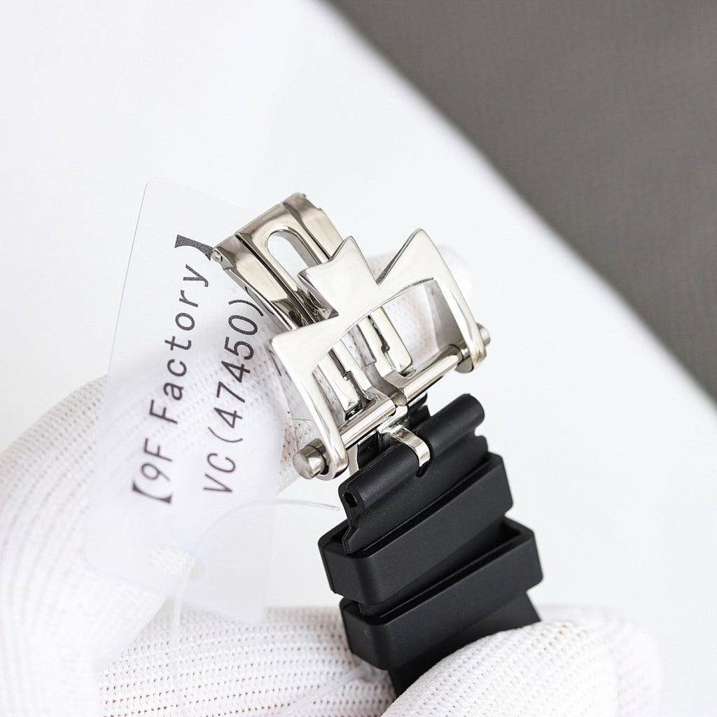 Stainless steel watch clasp side view with black rubber strap and label text