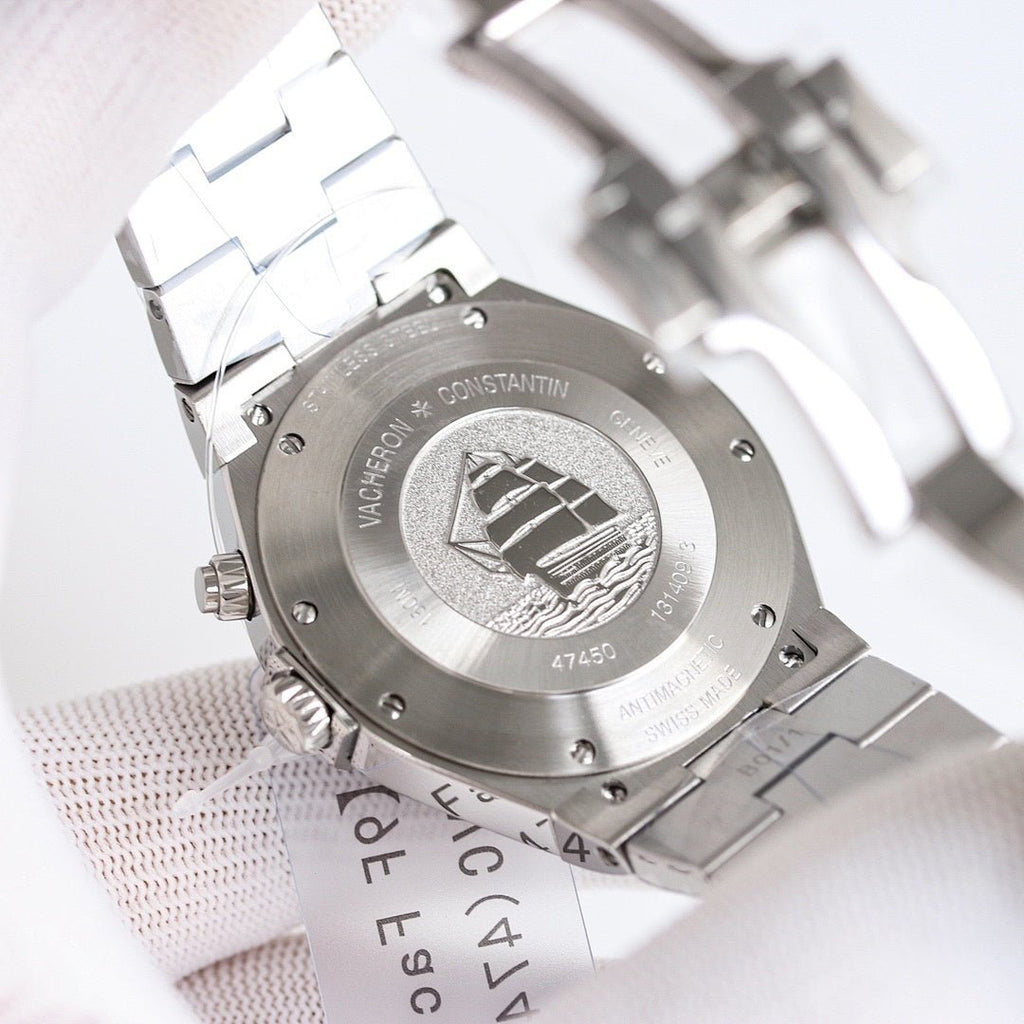 Vacheron Constantin watch caseback with engraved emblem and link bracelet