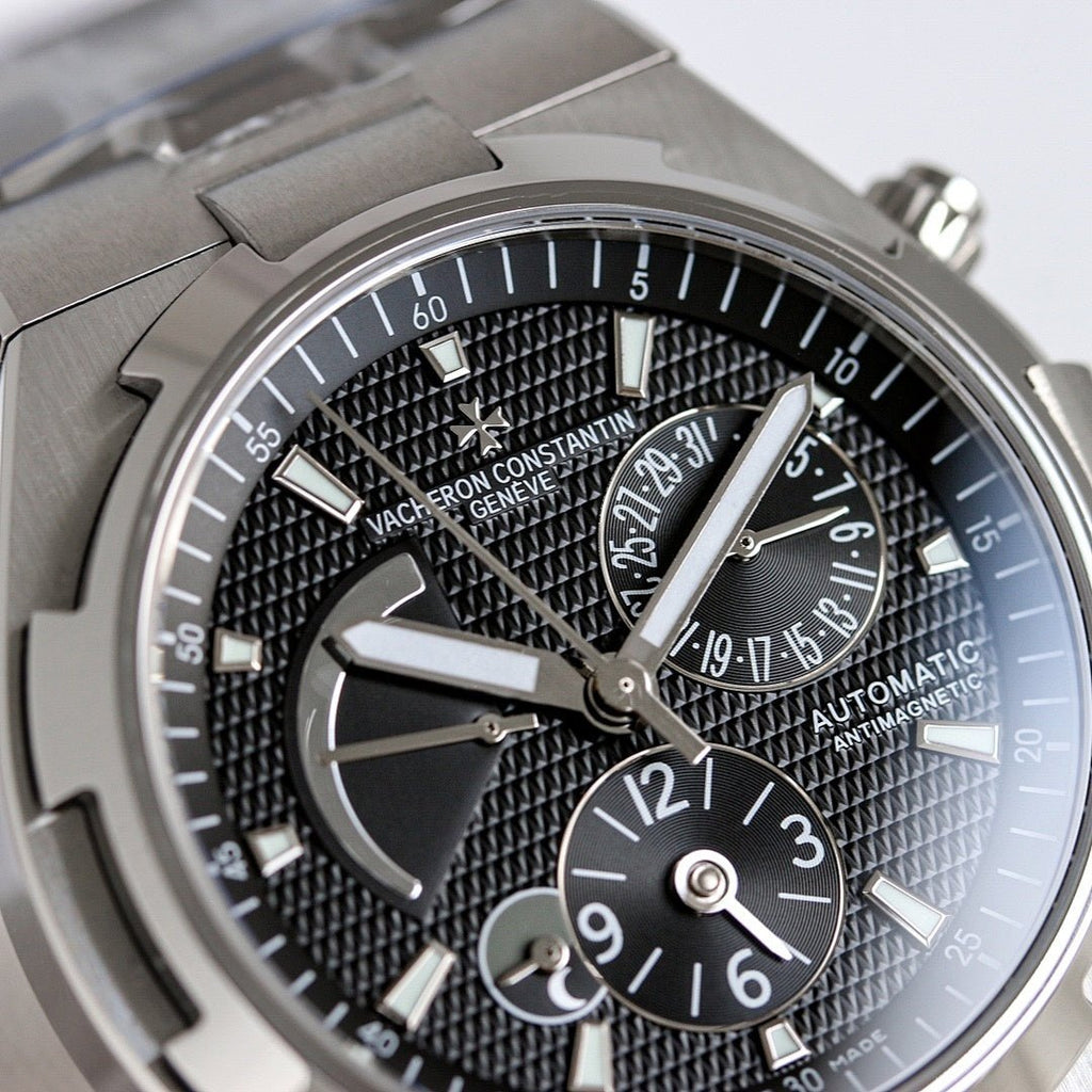 Vacheron Constantin watch close-up of black textured dial, baton markers, and subdials