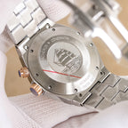 Vacheron Constantin watch caseback, brushed metal with engraved shield and visible screws