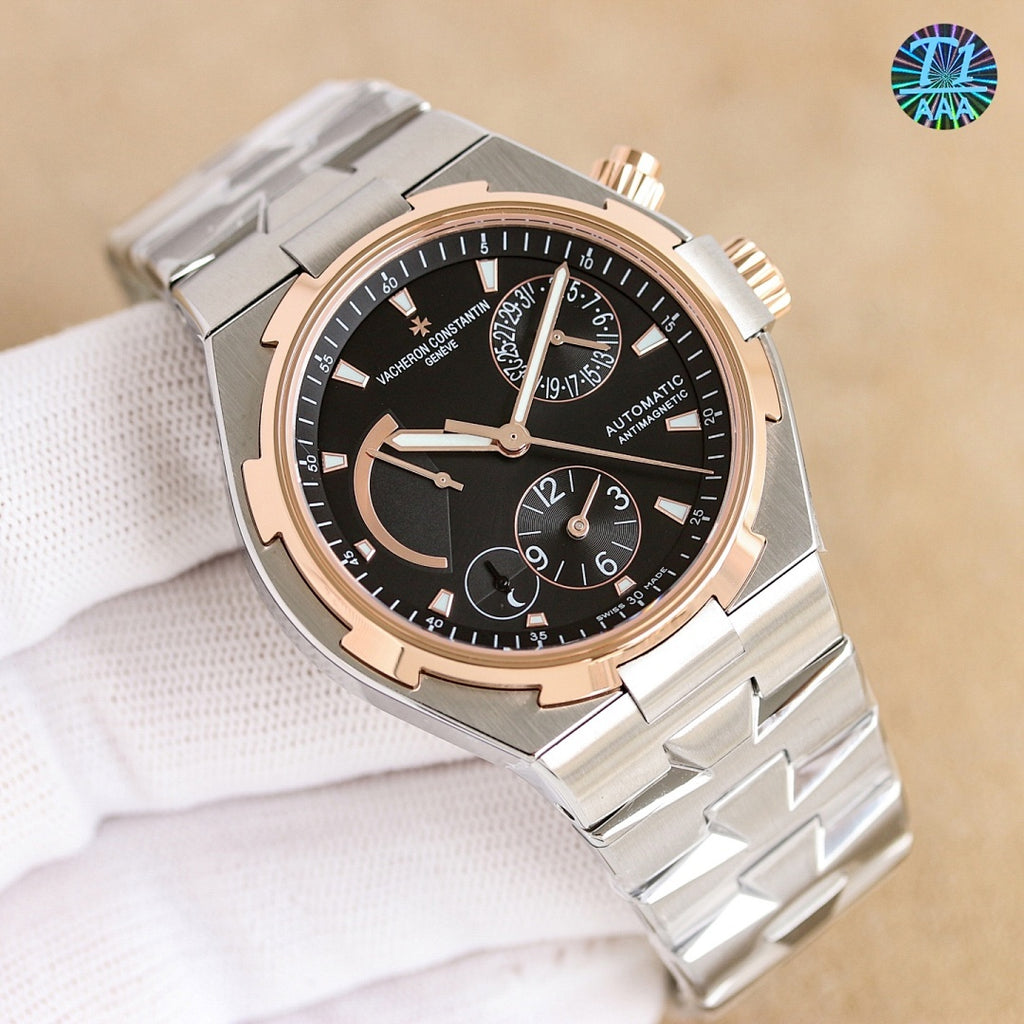 Vacheron Constantin watch, silver case with dark blue dial and rose-gold bezel accents