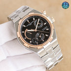 Vacheron Constantin watch, silver case with dark blue dial and rose-gold bezel accents