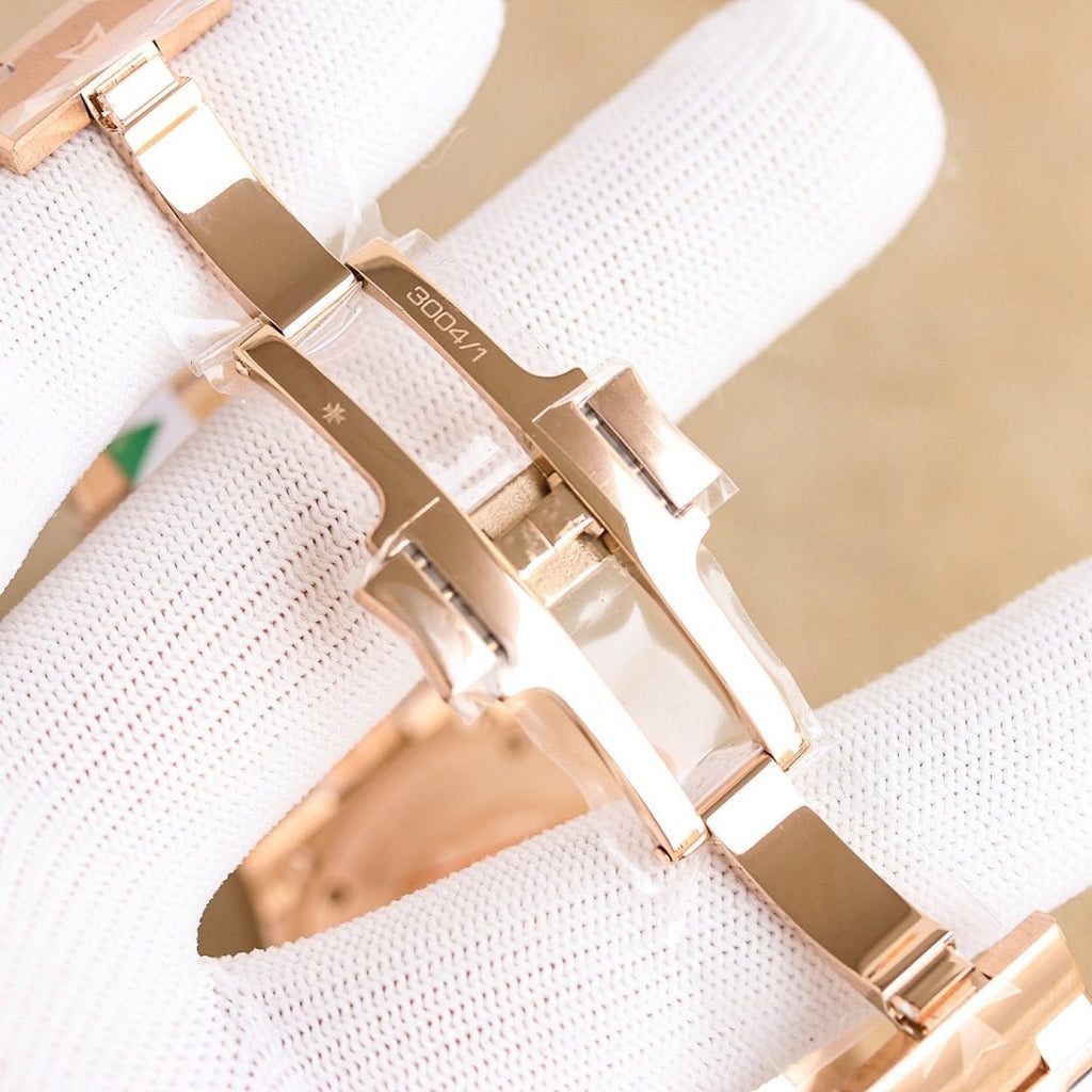 Vacheron Constantin bracelet watch, rose gold link metal band detail on white gloves