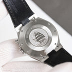 Vacheron Constantin watch caseback with engraved medallion and black leather strap