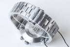 Stainless steel link bracelet for wristwatch with reflective polished surfaces