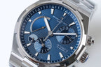 Round blue dial wristwatch with subdials, date window, and polished stainless case