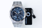 Stainless steel wristwatch with blue dial, three subdials, and steel bracelet