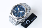 Blue-dial stainless steel wristwatch with three subdials and side crown