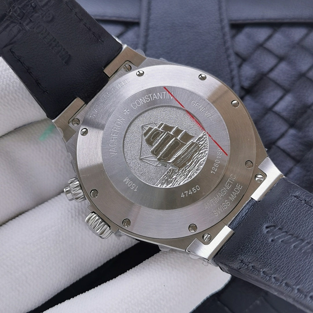 Stainless steel caseback with emblem and screws, navy leather strap