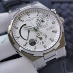 Wristwatch with silver textured dial, moonphase arc, subdials, navy strap