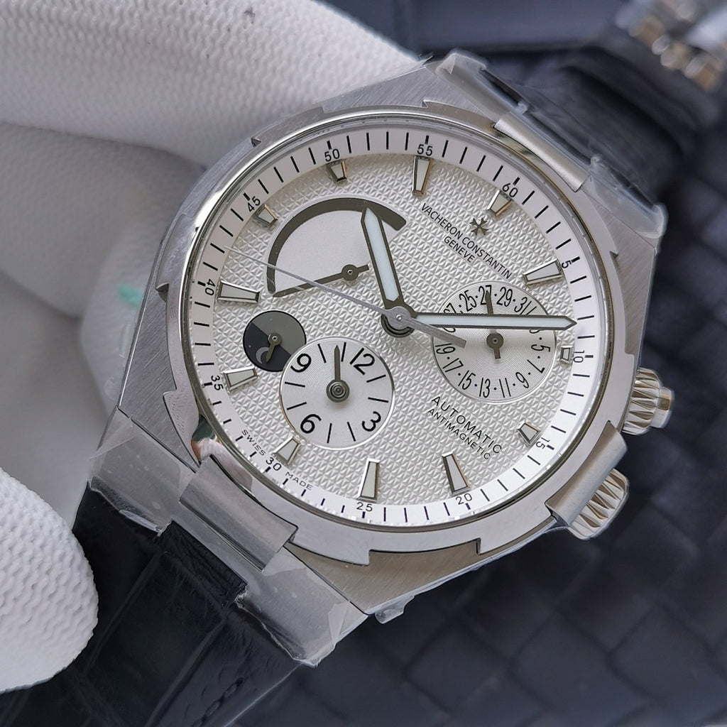 Wristwatch with silver textured dial, moonphase arc, subdial at 3 o'clock