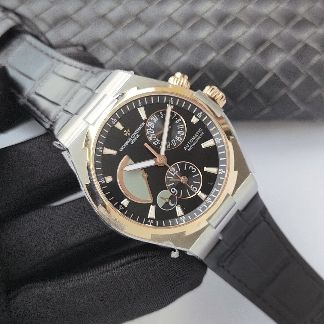 Vacheron Constantin watch with black dial, gold accents, and light gray leather strap