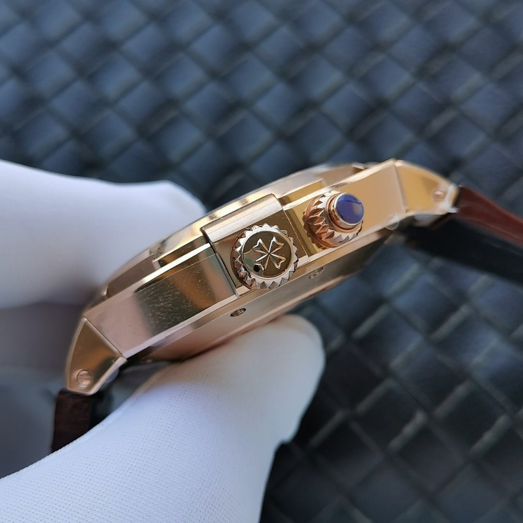Gold-tone watch side with crown and jewel detail on brown leather strap