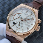 Automatic watch with gold-tone case, white dial, brown leather strap, subdials