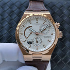 Automatic watch with gold-tone case, white dial, brown leather strap, subdials