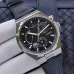 Vacheron Constantin automatic wristwatch with black dial on dark leather strap