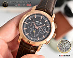 Rose gold wristwatch with black dial, brown leather strap, and date at 3 o'clock