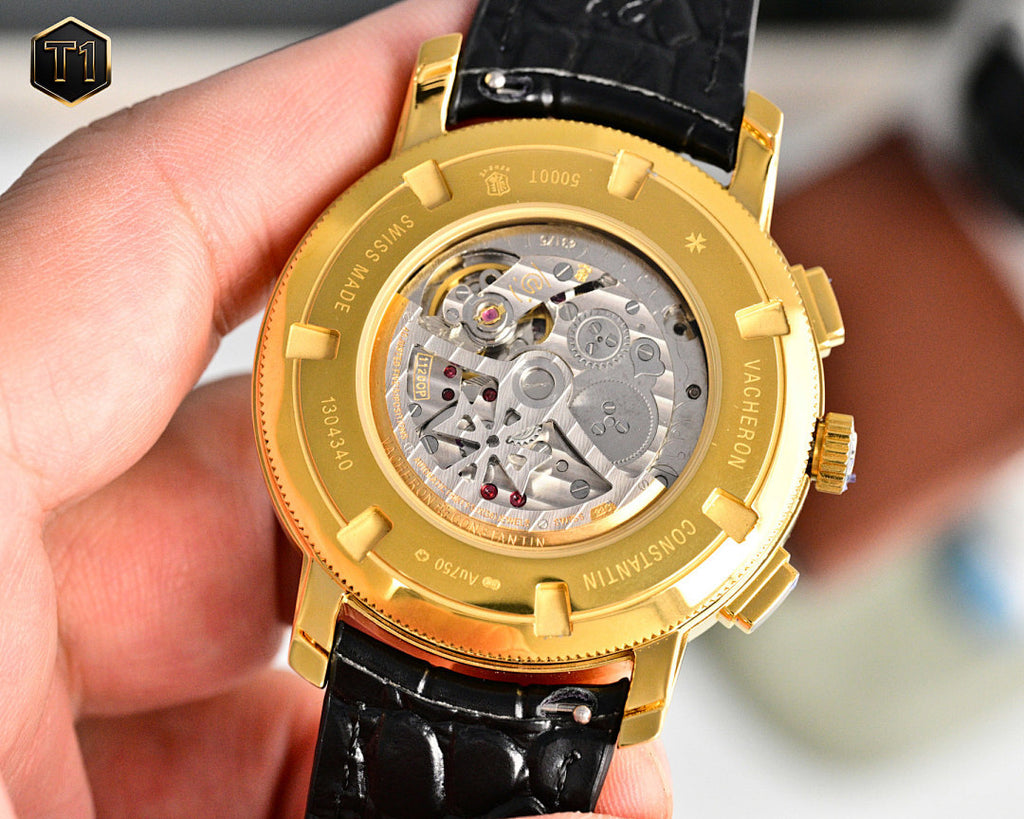 Vacheron Constantin wristwatch with gold case, open back showing mechanical movement and black strap