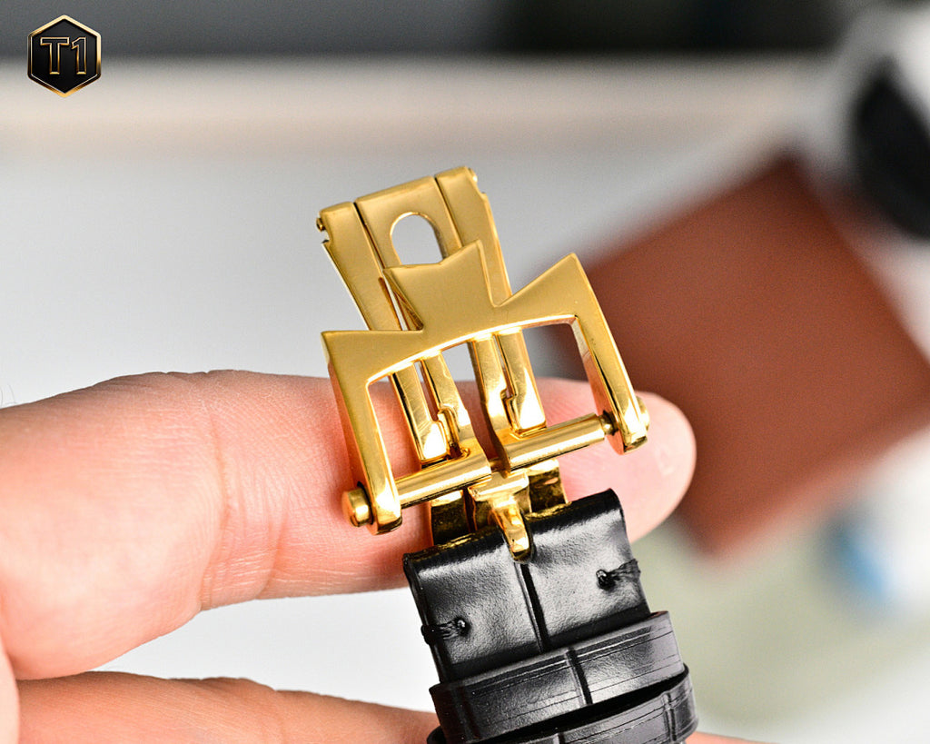 Vacheron Constantin wristwatch crown and gold clasp with black leather strap