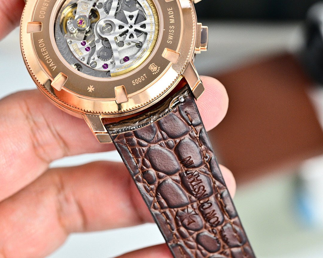 Vacheron Constantin watch case with visible mechanical movement and brown leather strap