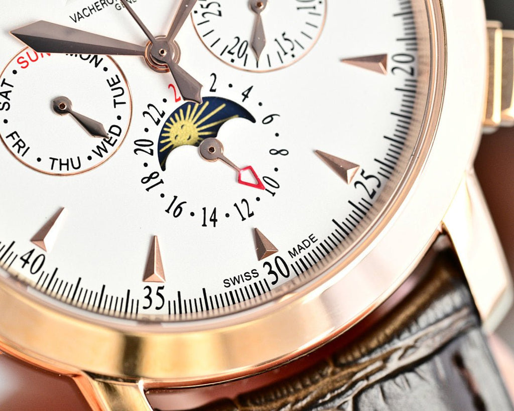 Vacheron Constantin watch dial close-up with rose gold markers and printed scale