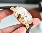 Vacheron Constantin wristwatch side view with brown leather strap and rose-gold case