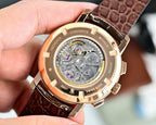 Vacheron Constantin watch caseback showing movement, brown leather strap and gold-tone bezel