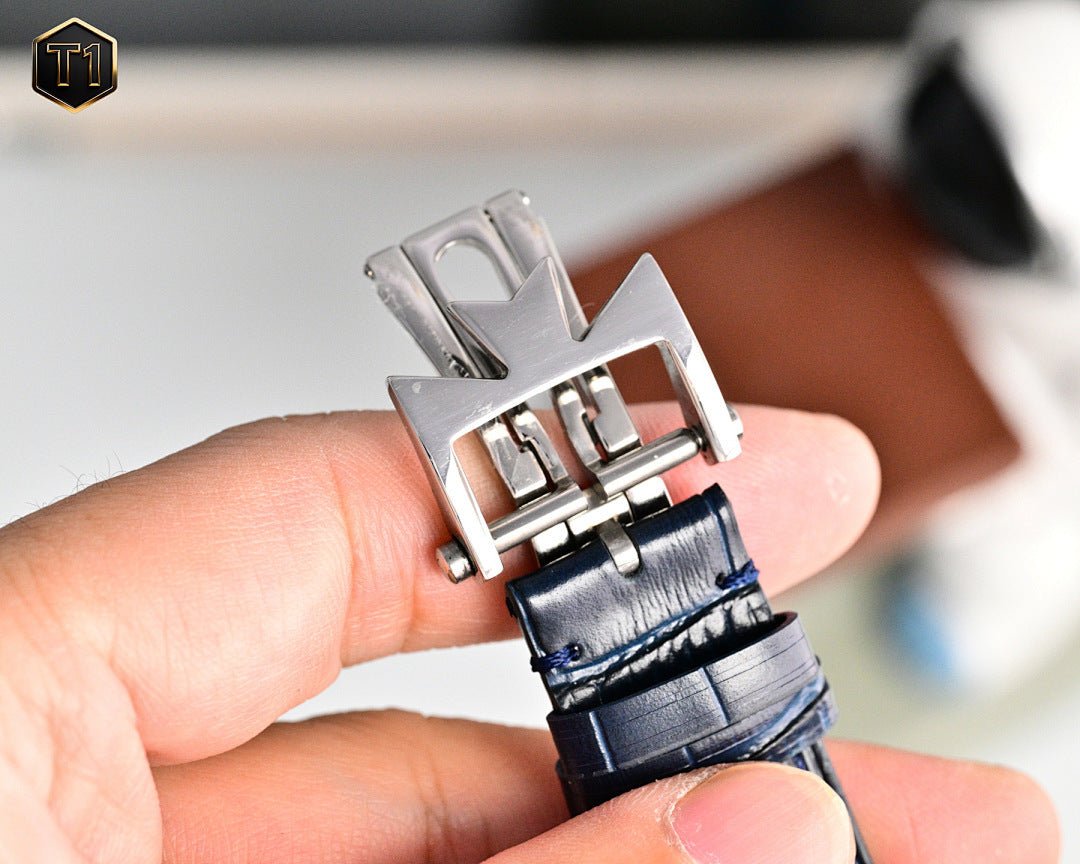 Men's wristwatch buckle and clasp with blue leather strap, silver metal hardware