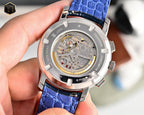 Men's wristwatch with white dial and blue leather strap, silver case with exposed movement