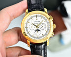 Gold-tone chronograph wristwatch with white dial and black leather strap, front view