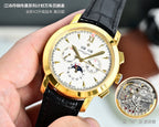 Gold-tone wristwatch with white dial, black leather strap, calendar subdials, gold caseback disc