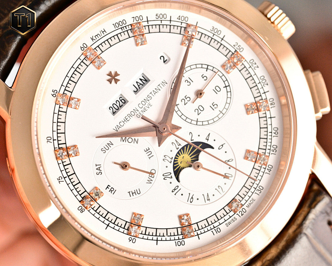 Close-up of rose-gold wristwatch dial with Roman markers, subdials and date window