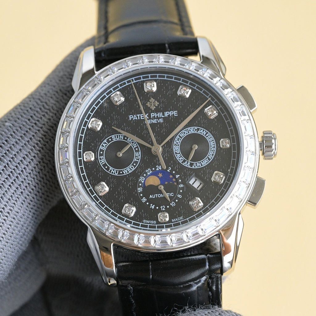 Luxury wristwatch with dark dial, black leather strap, diamond bezel, multiple subdials