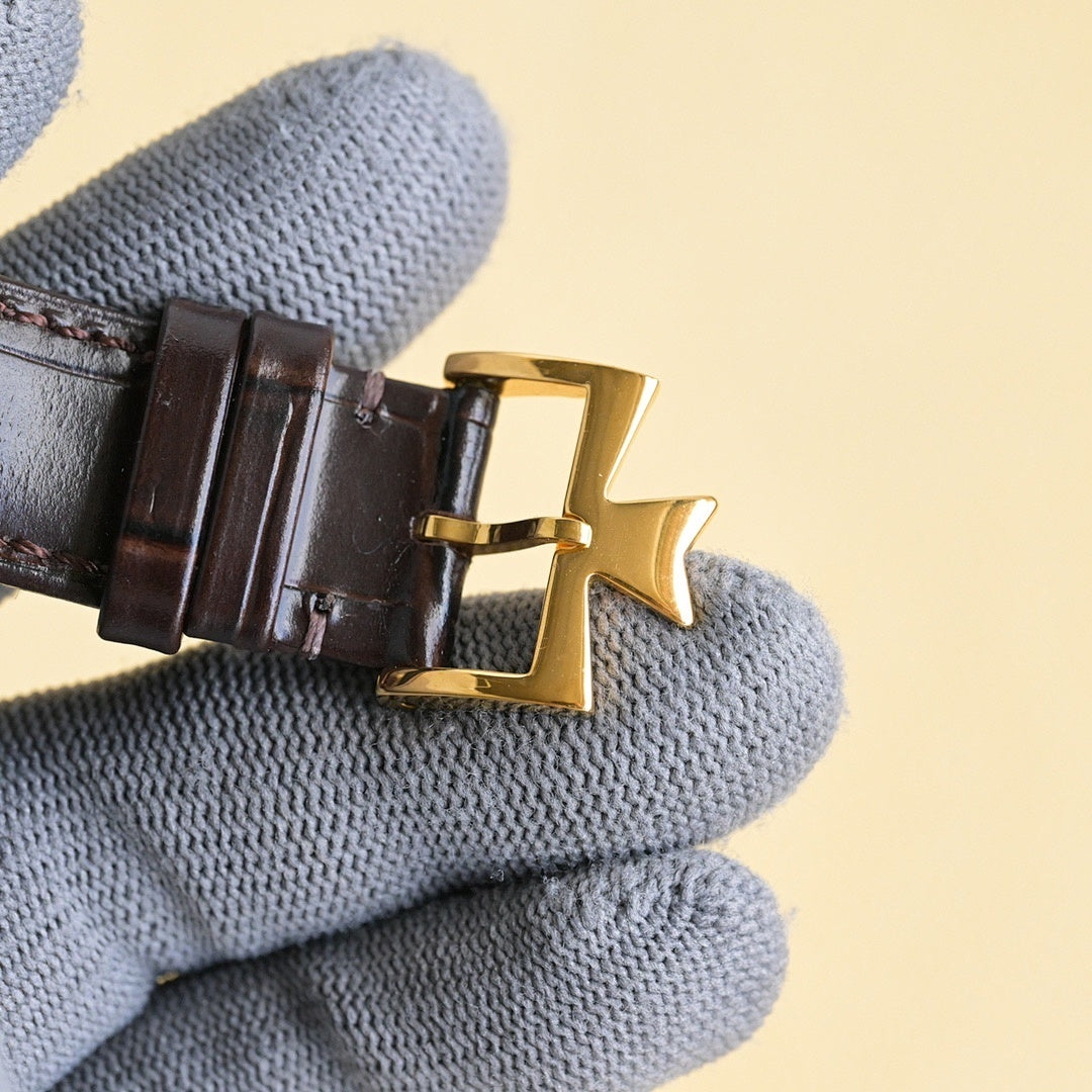 Vacheron Constantin wristwatch buckle and brown leather strap on wrist