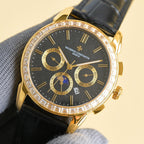 Vacheron Constantin wristwatch with black dial, gold case, diamond bezel, leather strap