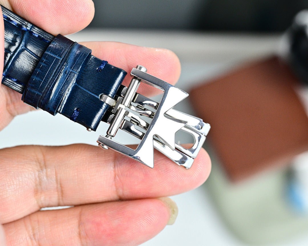 Vacheron Constantin watch with silver buckle and blue textured leather strap