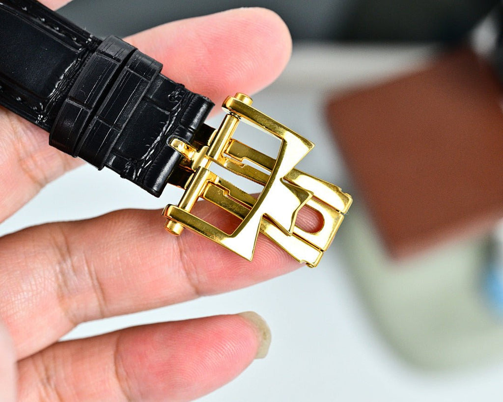 Black leather strap with gold buckle and clasp hardware