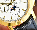 Close-up of watch dial with Roman numerals, gold bezel, black leather strap edge