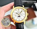 Gold wristwatch with white dial, black leather strap, gold Roman numerals and subdials