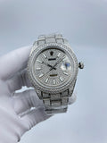 Rolex diamond bezel watch with silver bracelet, dark dial, baton markers