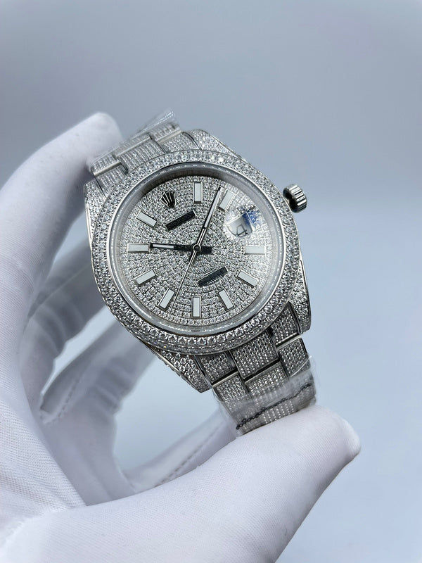 Diamond bezel watch with silver dial, baton indexes, crown at 3 o'clock
