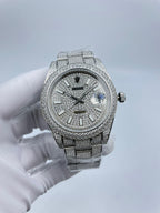 Rolex diamond watch on silver link bracelet, dark dial with blue accent