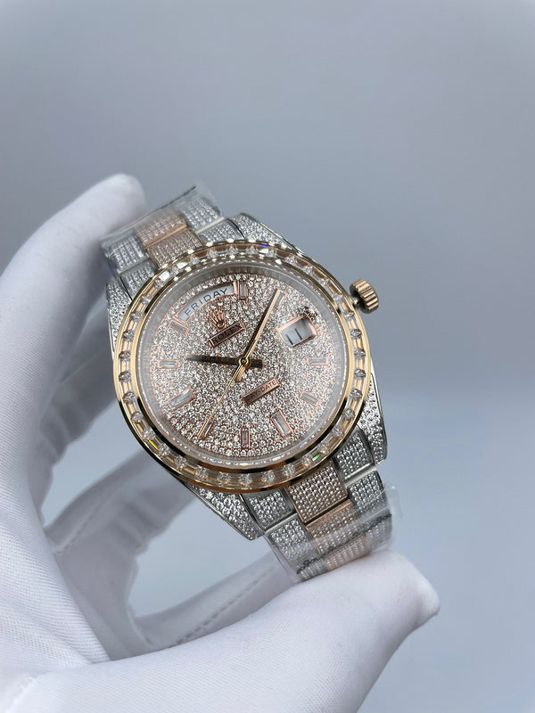 Rolex watch with jeweled dial, gold-tone hour markers, diamond bezel, and metal bracelet.