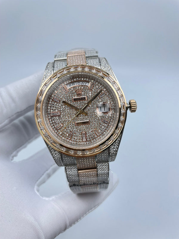 Rolex watch with silver jeweled dial, gold-tone bezel, and crystal hour markers.