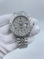 Diamond-accent bezel wristwatch with dark dial and silver metal link bracelet
