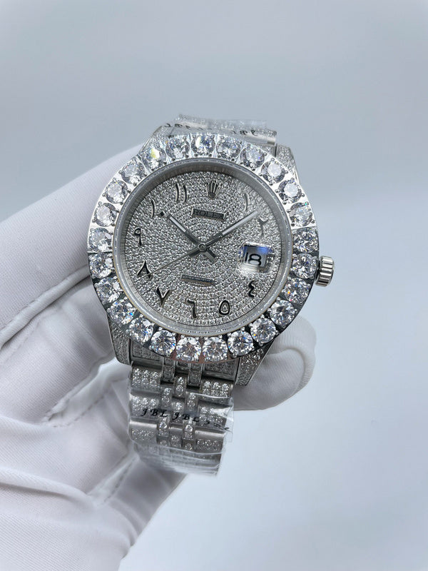 Diamond-accent bezel wristwatch with dark dial and silver metal link bracelet